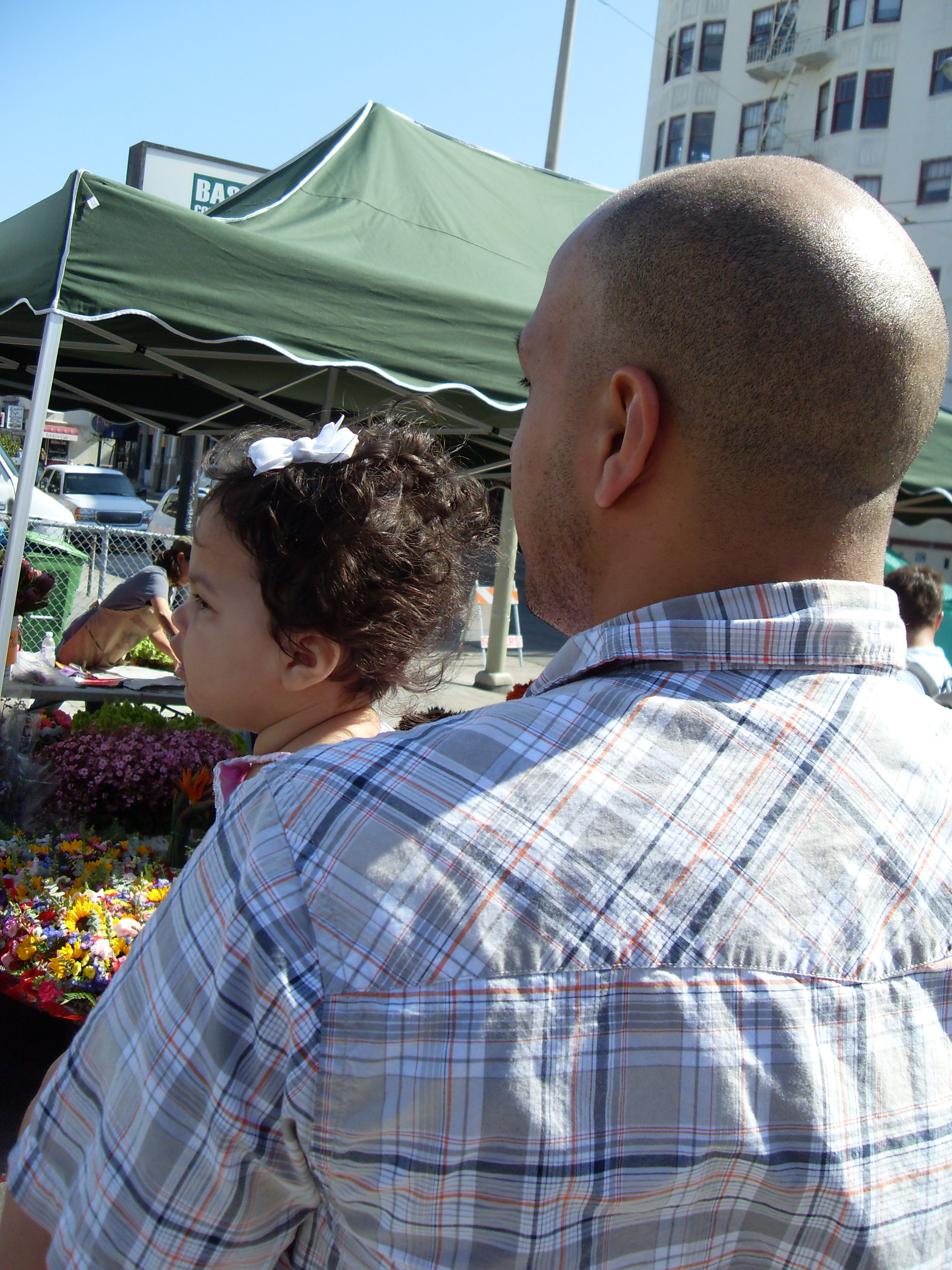 Father and baby at farmers market