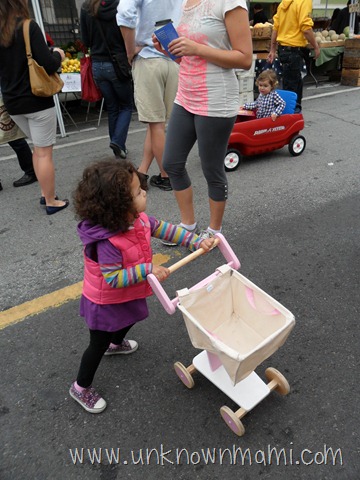 Little girl with canvas shopping cart