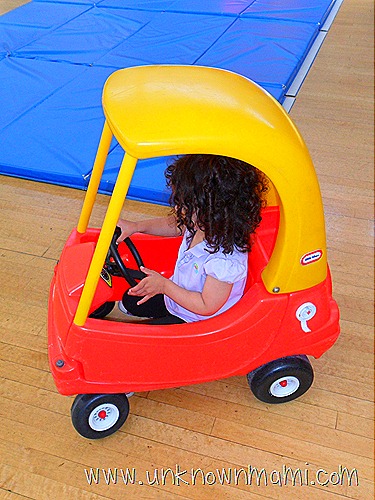 Child in toy car