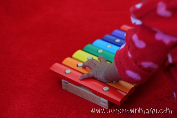 Baby hand on xylophone