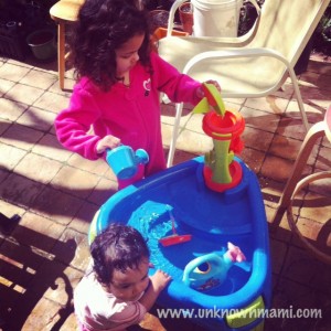 Children playing with water table.