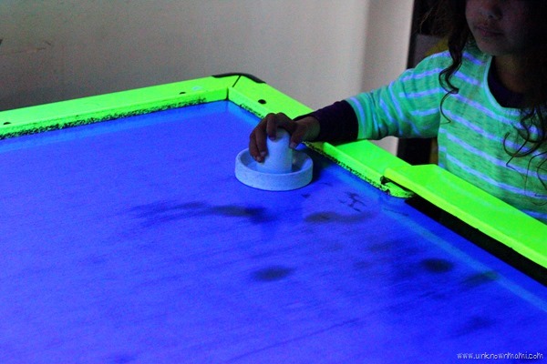 Playing air hockey