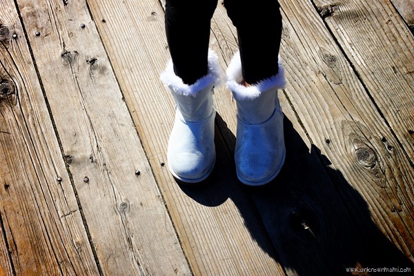 Sparkly booties on wooden floor