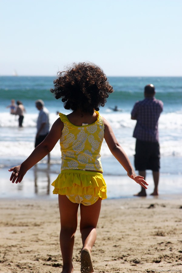 child running on the beach