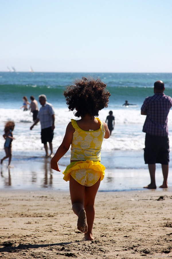 little girl running on the beach