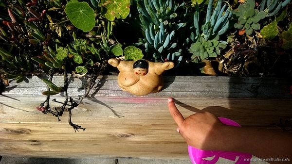 sumo figurine in garden