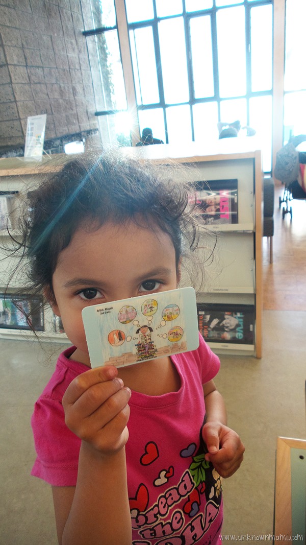 Child with first library card