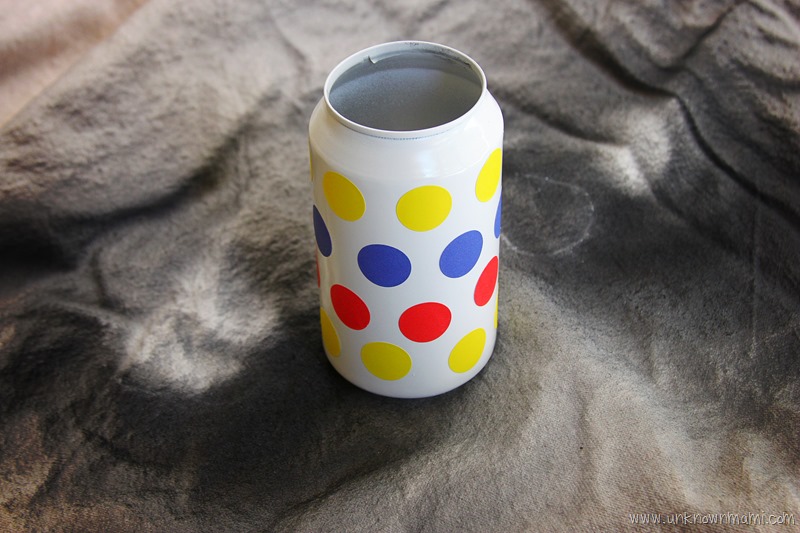 Make a polka dot design on aluminum can craft