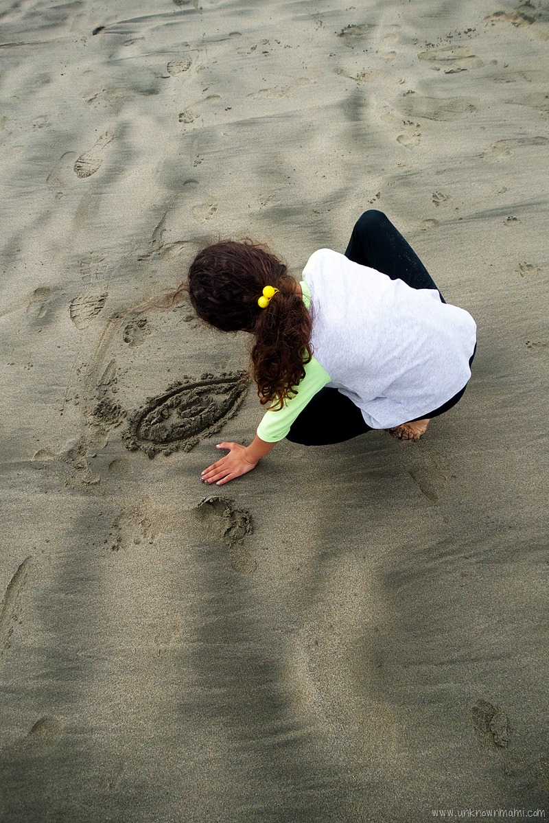 Drawing in the sand at Pacifica State Beach