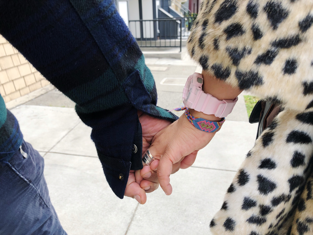 Couple holding hands