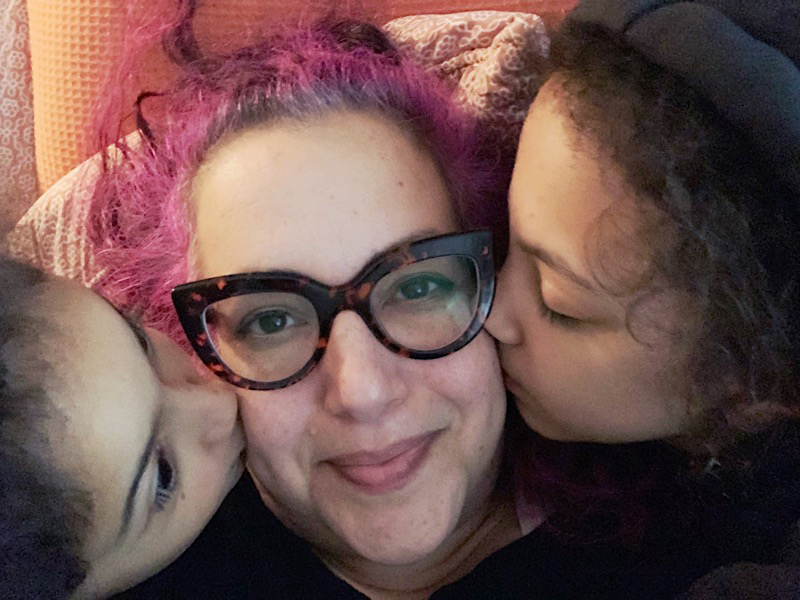 daughters kissing mom
