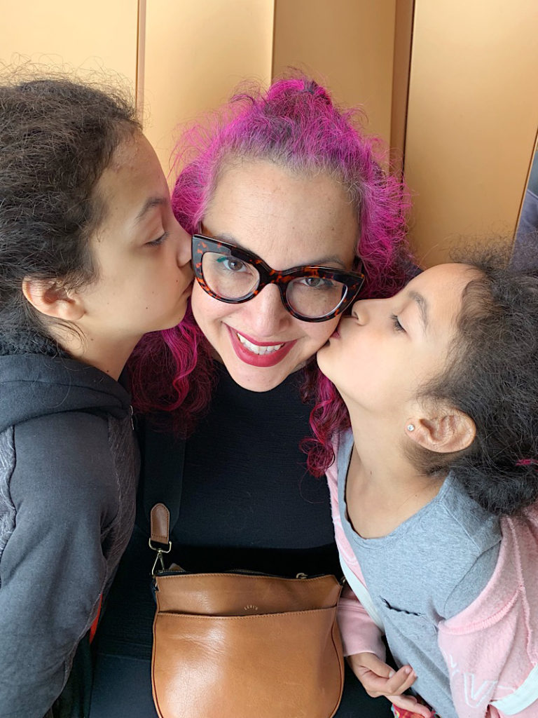 daughters kissing mom