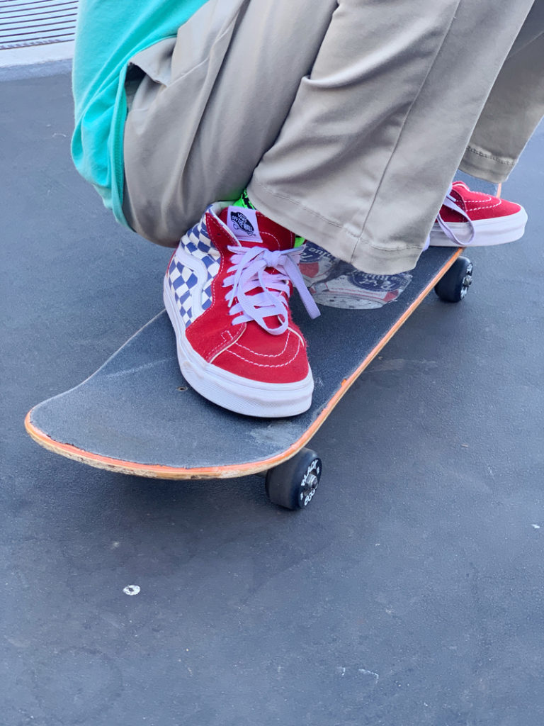 checkerboard old skool vans on skateboard