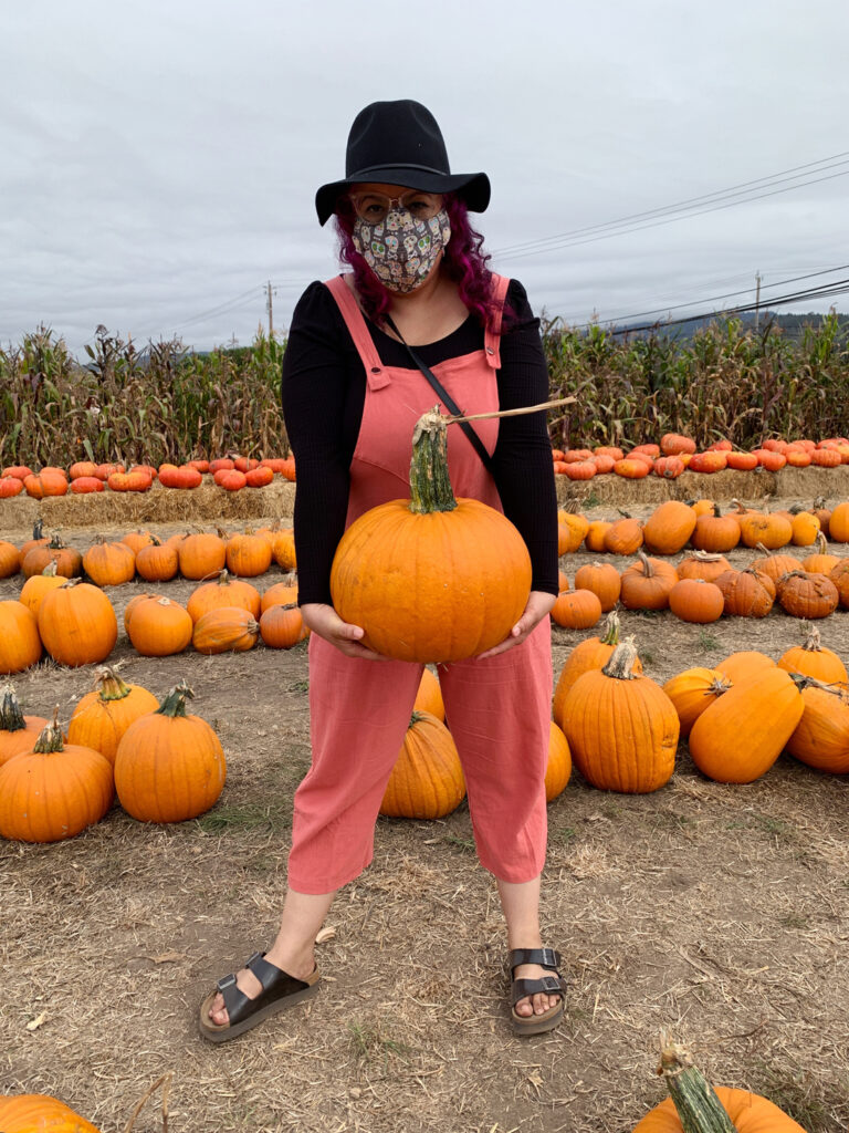 woman holding pumpkin